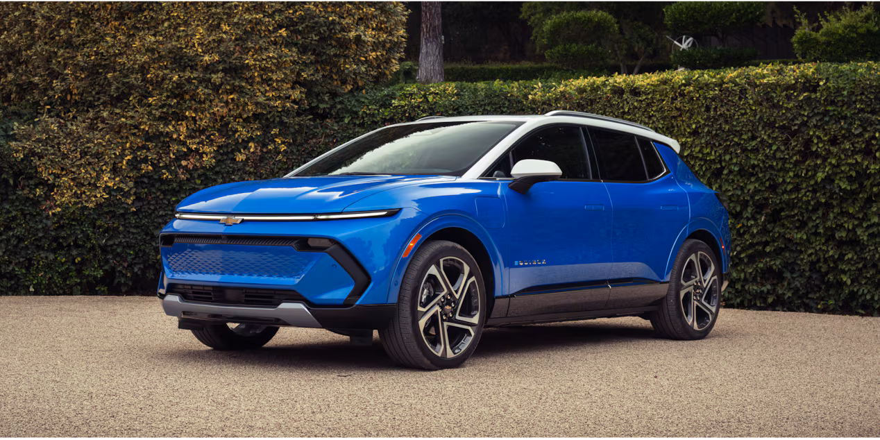 2027 Chevrolet Equinox EV driving on a road